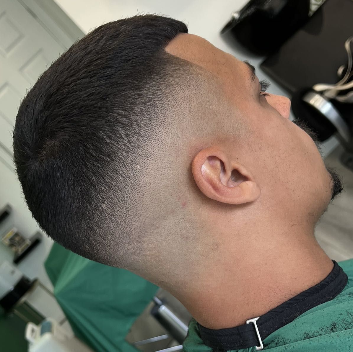 High skin fade with clean line-up